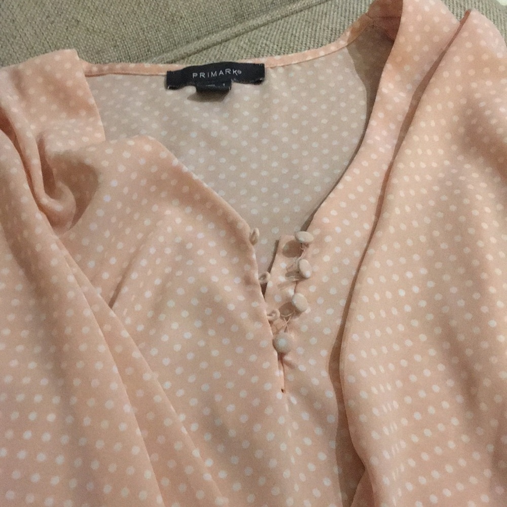 Pink and white polka dot blouse